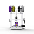 3D printer labeled Anycubic Kobra X by 3dfactorylb with metal frame and touchscreen control panel in a clean workspace