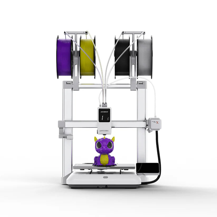 3D printer labeled Anycubic Kobra X by 3dfactorylb with metal frame and touchscreen control panel in a clean workspace