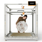 3dfactorylb Elegoo OrangeStorm Giga 3D printer with orange frame and large build volume, shown in a well-lit workshop setting