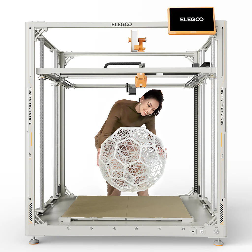 3dfactorylb Elegoo OrangeStorm Giga 3D printer with orange frame and large build volume, shown in a well-lit workshop setting